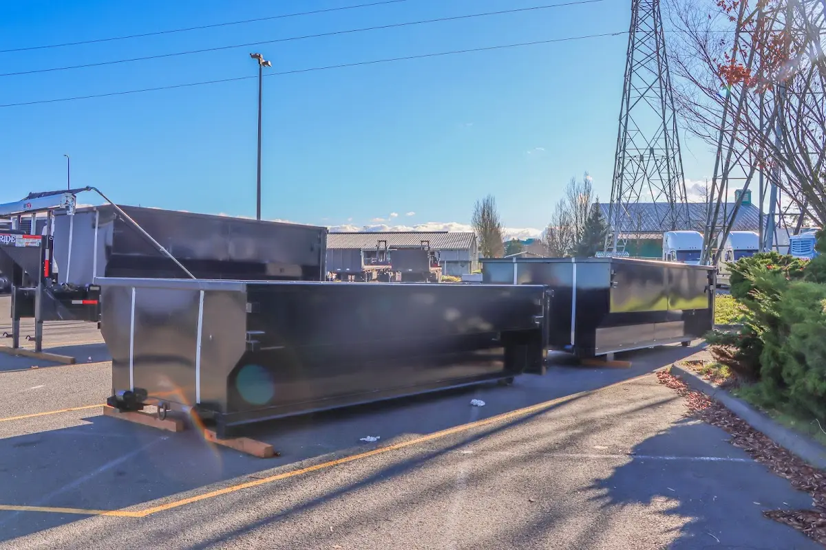 Roll-off dumpster ready for waste disposal at job site for 3 Yard Dumpster Rental in Dover